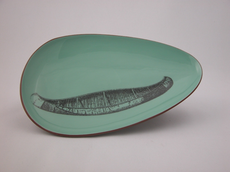 blue plate with image of a canoe