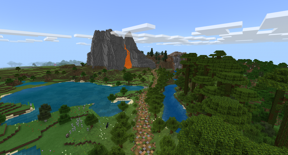 A Minecraft screenshot of a path leading across a rural landscape toward a large volcano with lava pouring down the side.